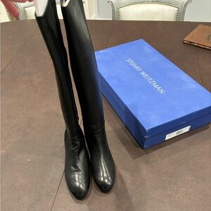 Stuart Weitzman size 7 never worn, in box boots. Style Eloise black hybrid bama